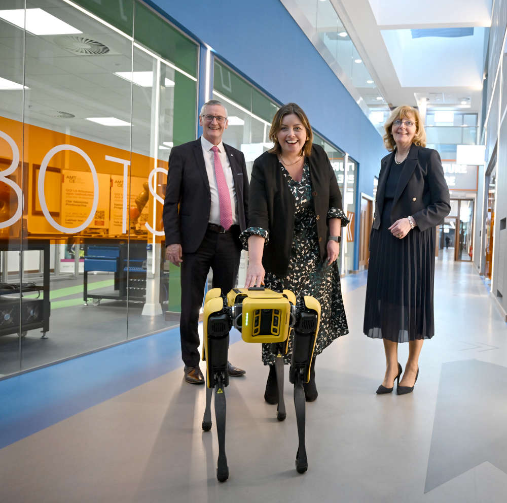 Martin O’Brien, chief executive, LMETB with Minister Deirdre Hargey and Sadie Ward McDermott, director of FET at LMETB with Spot the robotic dog