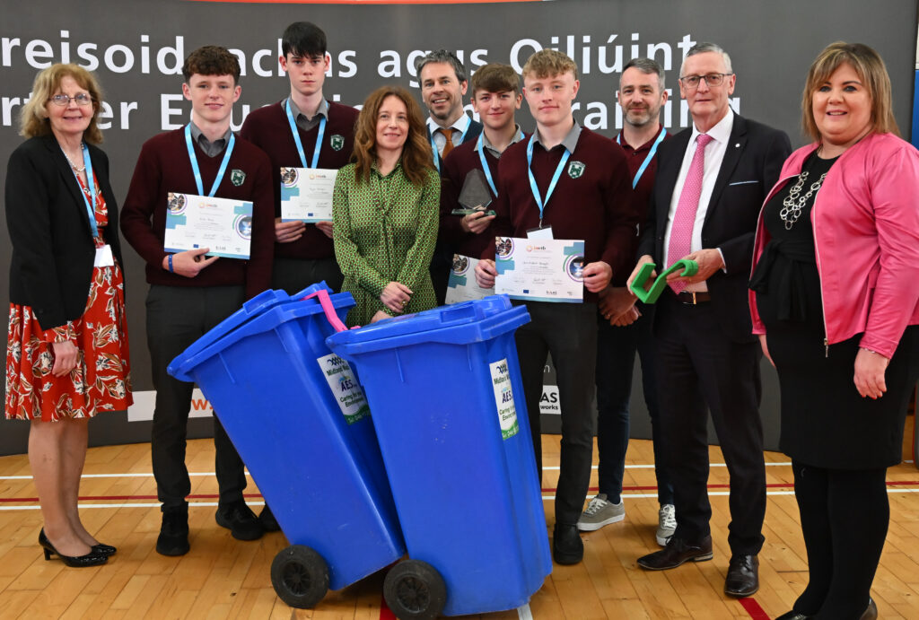 Group of students receiving awards for a school recycling initiative, highlighting their achievement in a sustainability-focused education project.